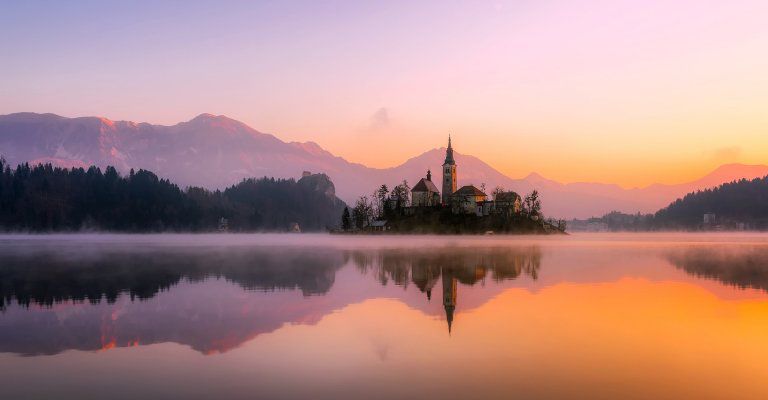 about conscious living - building on island at sunset