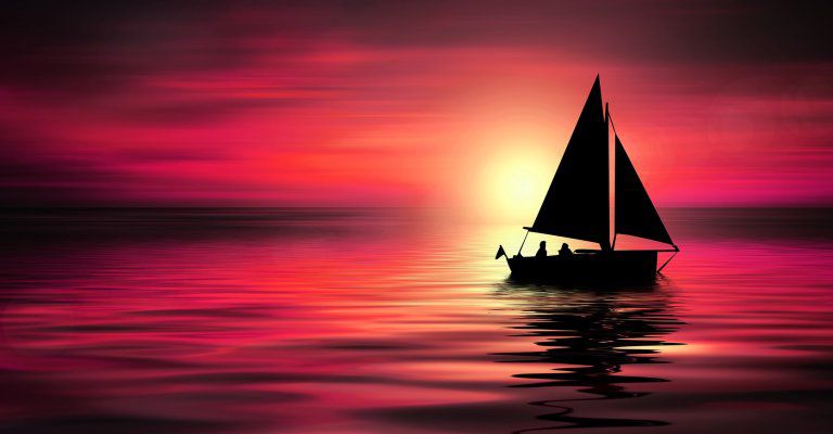 about conscious living - sailing boat in red sunset